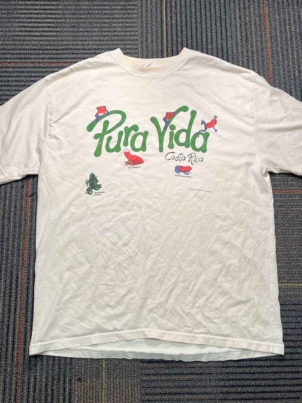 Pura Vida White Tee with Green Logo and Red/Blue Frog Accents